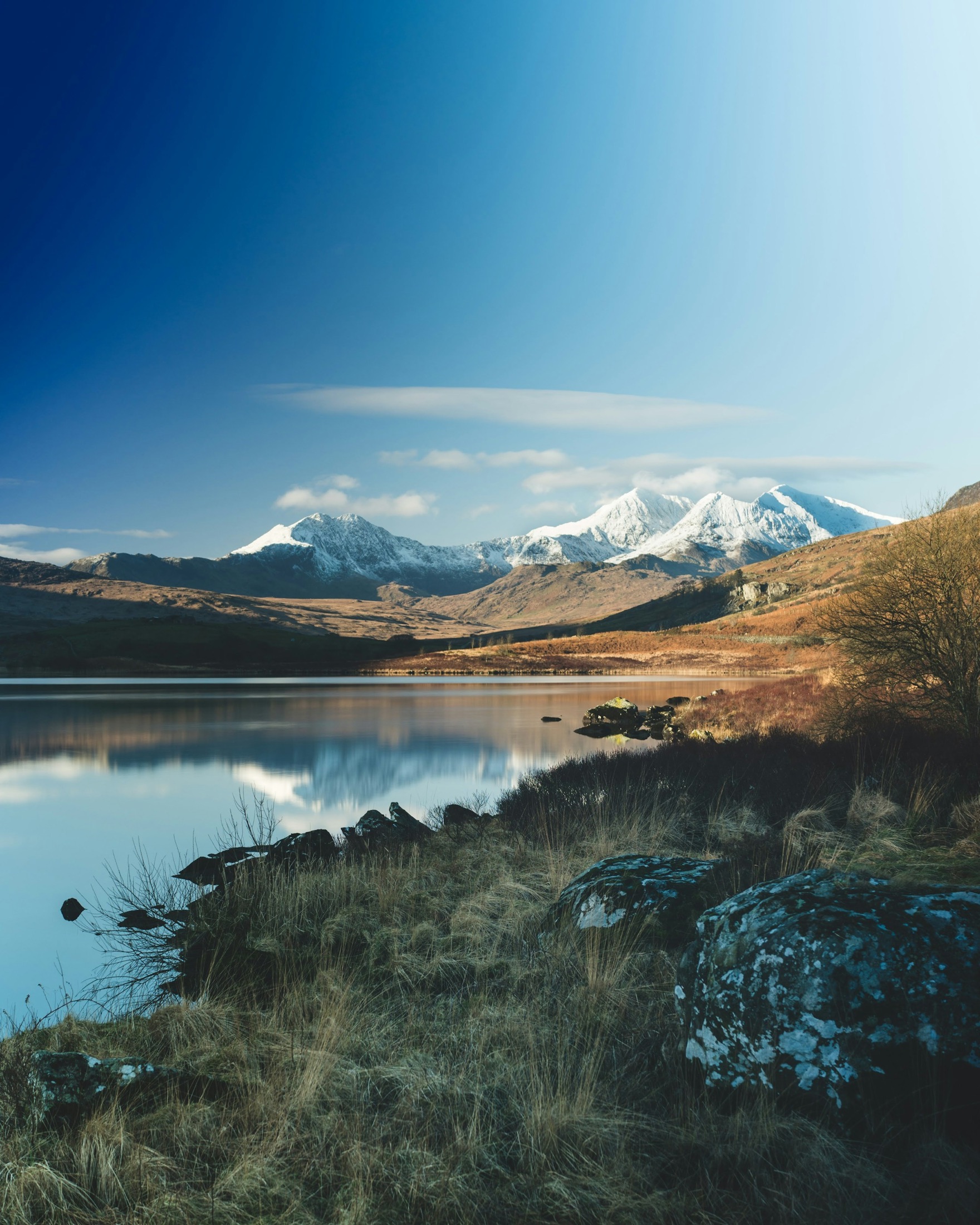 A lake beneath the mountains of Eryri in North Wales